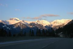 11 Mount Bourgeau And Mount Brett Sunrise From Trans Canada Highway Just After Leaving Banff Towards Lake Louise In Winter.jpg